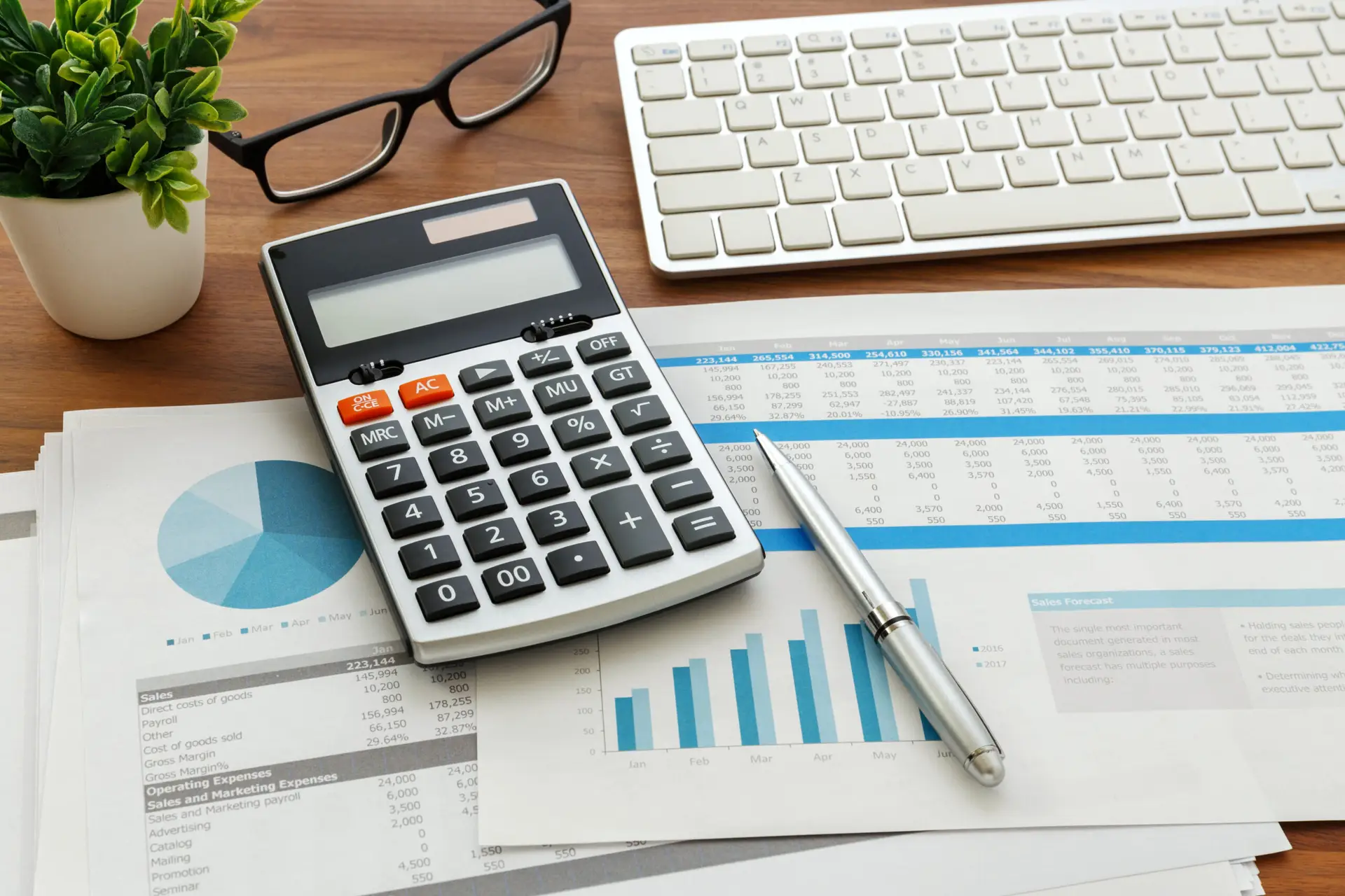Business Valuation Graphs with a calculator on a desk